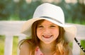 Smiling and laughing kids face closeup. Little girl outdoors, close-up. Portrait of attractive little teen with Royalty Free Stock Photo