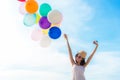 Smiling lifestyle asian woman chill hand holding balloon on the beach. Relax and Enjoy in summer holiday. Royalty Free Stock Photo