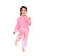 Smiling little Asian child girl in pink tracksuit or sport cloth running isolated over white background with copy space. Freedom Royalty Free Stock Photo