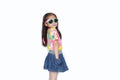 Smiling little Asian child girl wearing a floral pattern summer dress and sunglasses isolated on white background. Summer and Royalty Free Stock Photo