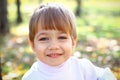 Smiling little boy in the autumn forest Royalty Free Stock Photo