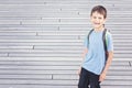 Smiling little boy with backpack. Back to school, education, travel concept