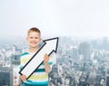 Smiling little boy with blank arrow pointing right Royalty Free Stock Photo