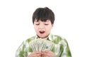 A smiling little boy is counting money Royalty Free Stock Photo