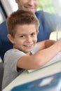 Smiling little boy doing homework Royalty Free Stock Photo