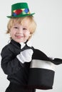 Smiling little boy in a green hat holding a black Royalty Free Stock Photo