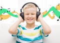 Smiling little boy with headphones at home Royalty Free Stock Photo