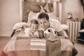 Smiling little boy and his father watching a football match Royalty Free Stock Photo