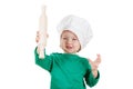 Smiling little boy kneading dough for the cookies, isolated on white Royalty Free Stock Photo