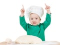 Smiling little boy kneading dough for the cookies, isolated on white Royalty Free Stock Photo