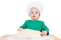 Smiling little boy kneading dough for the cookies, isolated on white Royalty Free Stock Photo