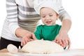 Smiling little boy kneading dough for the cookies, isolated on white Royalty Free Stock Photo