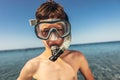 Smiling little boy with scuba mask and snorkel by the sea Royalty Free Stock Photo