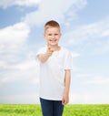 Smiling little boy in white blank t-shirt Royalty Free Stock Photo