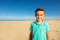 Smiling little Caucasian boy on the sand beach Royalty Free Stock Photo