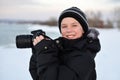 Smiling little caucasian boy taking photos outdoor Royalty Free Stock Photo