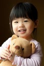 Smiling little child with a teddy bear Royalty Free Stock Photo