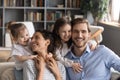 Smiling little children hug happy young parents Royalty Free Stock Photo