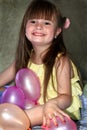 Smiling Little Girl with Balloons Royalty Free Stock Photo