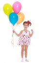 Smiling little girl with beads in their hands Royalty Free Stock Photo