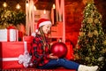 smiling little girl. Beautiful holdiay decorated room with Christmas tree. Night Xmas. delivery christmas gifts. happy Royalty Free Stock Photo