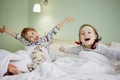 Smiling little girl and boy outstretched arms in