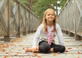 Smiling little girl on bridge