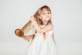 Smiling little girl brushing her hair closeup Royalty Free Stock Photo