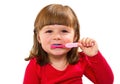 Smiling little girl brushing teet