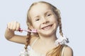 Smiling little girl brushing teeth Royalty Free Stock Photo