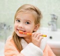 Smiling little girl brushing teeth Royalty Free Stock Photo