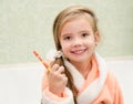 Smiling little girl brushing teeth Royalty Free Stock Photo