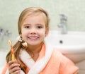 Smiling little girl brushing teeth Royalty Free Stock Photo