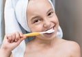Smiling little girl brushing teeth Royalty Free Stock Photo
