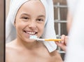 Smiling little girl brushing teeth Royalty Free Stock Photo