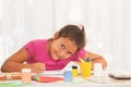Smiling little girl drawing and looking at camera in class Royalty Free Stock Photo
