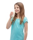 Smiling little girl drinking milk out of glass Royalty Free Stock Photo