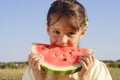 Smiling little girl eating watermelon Royalty Free Stock Photo