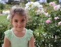 Smiling little girl and flowers