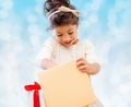 Smiling little girl with gift box Royalty Free Stock Photo