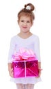 Smiling little girl with a gift in their hands Royalty Free Stock Photo