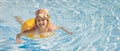 smiling little girl having fun in swimming pool with inflatable ring. copy space Royalty Free Stock Photo