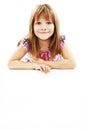 Smiling little girl holding empty white board Royalty Free Stock Photo