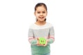 smiling little girl holding green house icon Royalty Free Stock Photo