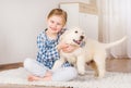 Smiling girl hugging retriever puppy Royalty Free Stock Photo