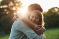 Smiling little girl hugging her father outside Royalty Free Stock Photo