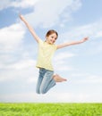 Smiling little girl jumping Royalty Free Stock Photo