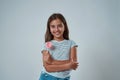 Smiling little girl with lollipop look at camera Royalty Free Stock Photo