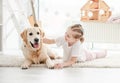 Smiling little girl petting adorable dog Royalty Free Stock Photo