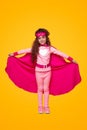 Smiling little girl in pink super hero outfit Royalty Free Stock Photo
